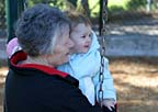 Grandma and me on the swings